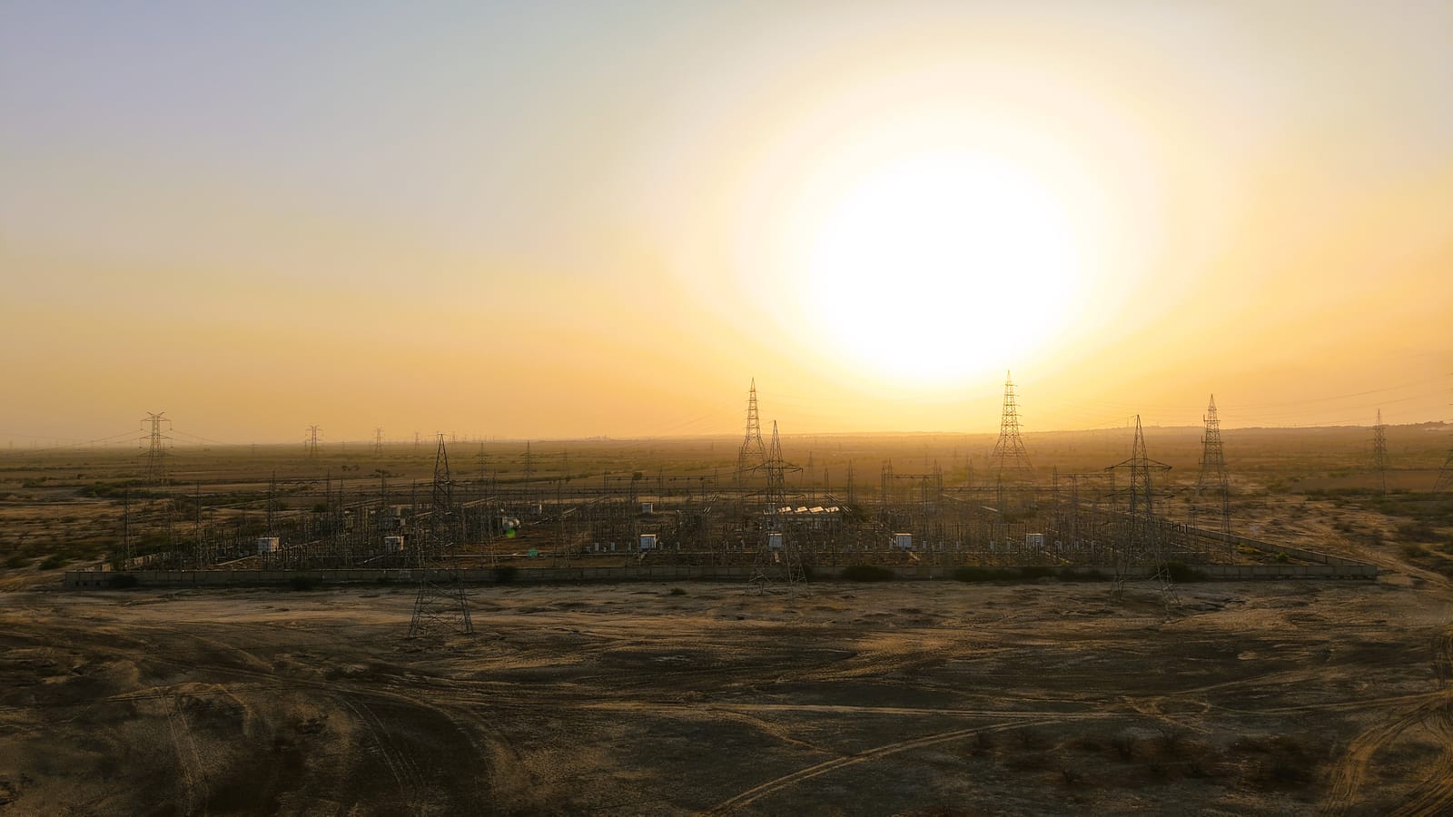 High-voltage substation being commissioned at dusk