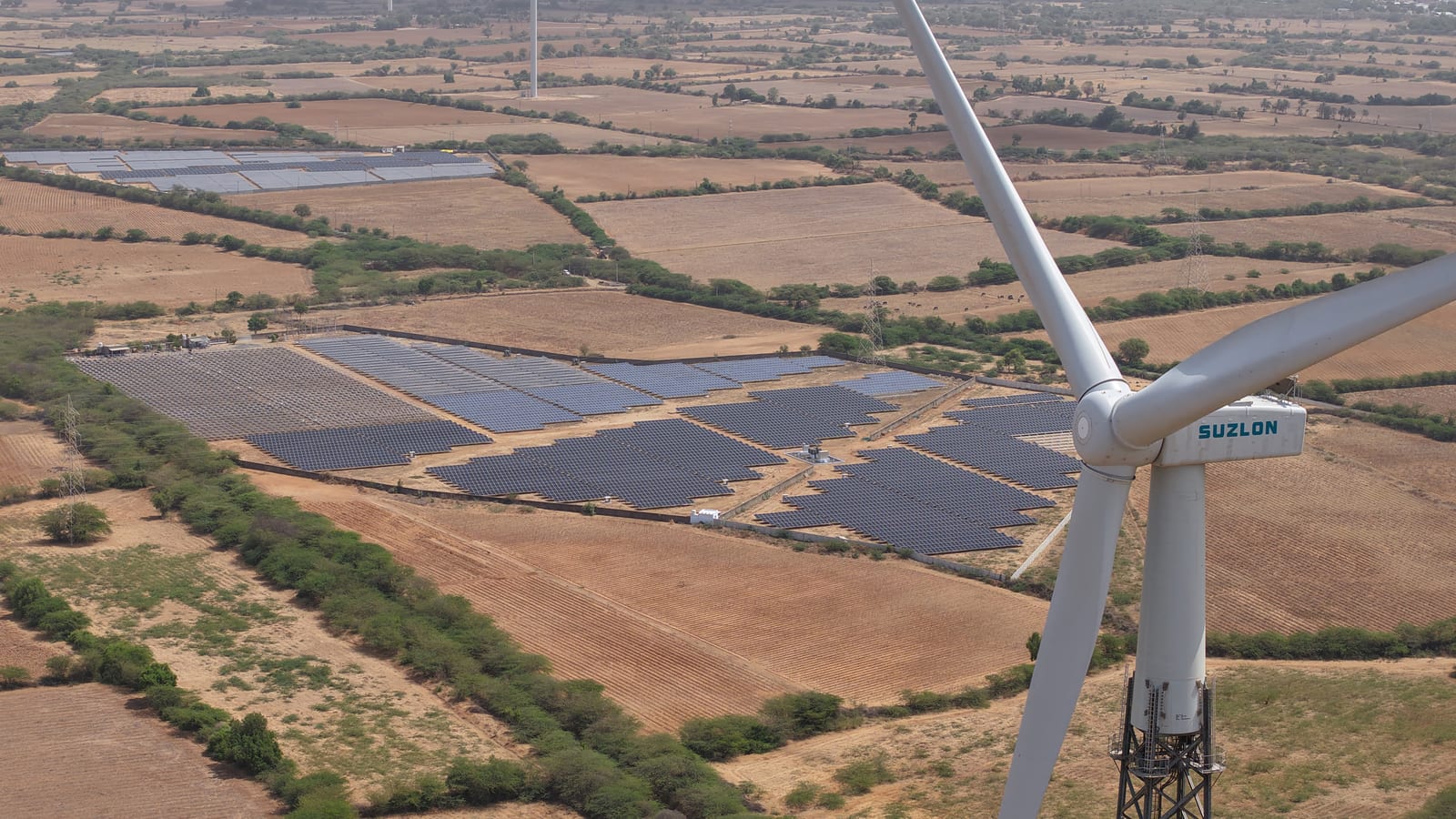 Solar arrays and a wind turbine, sustainable electrical infrastructure